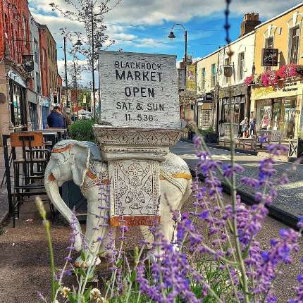 A statue of an elephant with the opening times of blackrock market